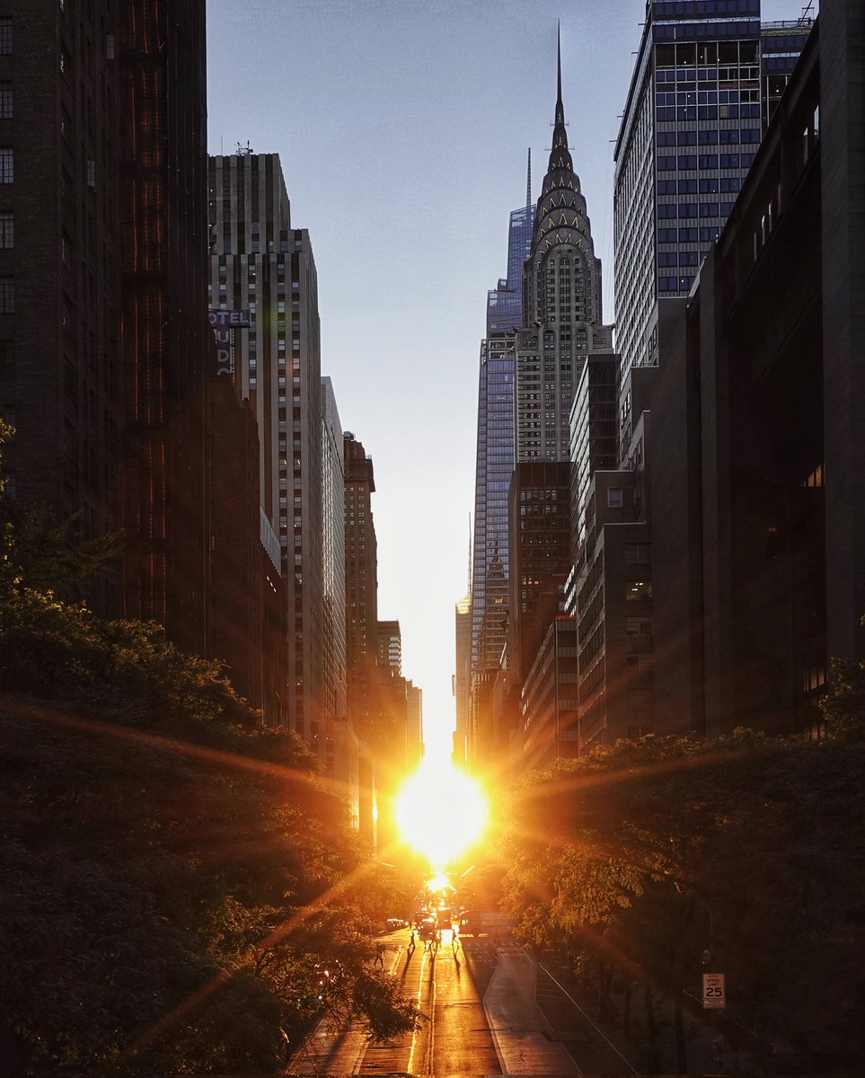 GaryHershorn's tweet photo. The sun sets behind the Chrysler Building along 42nd Street in New York City, Monday evening #newyorkcity #nyc #newyork #chryslerbuilding #sunset https://t.co/0sgqVFR2sg