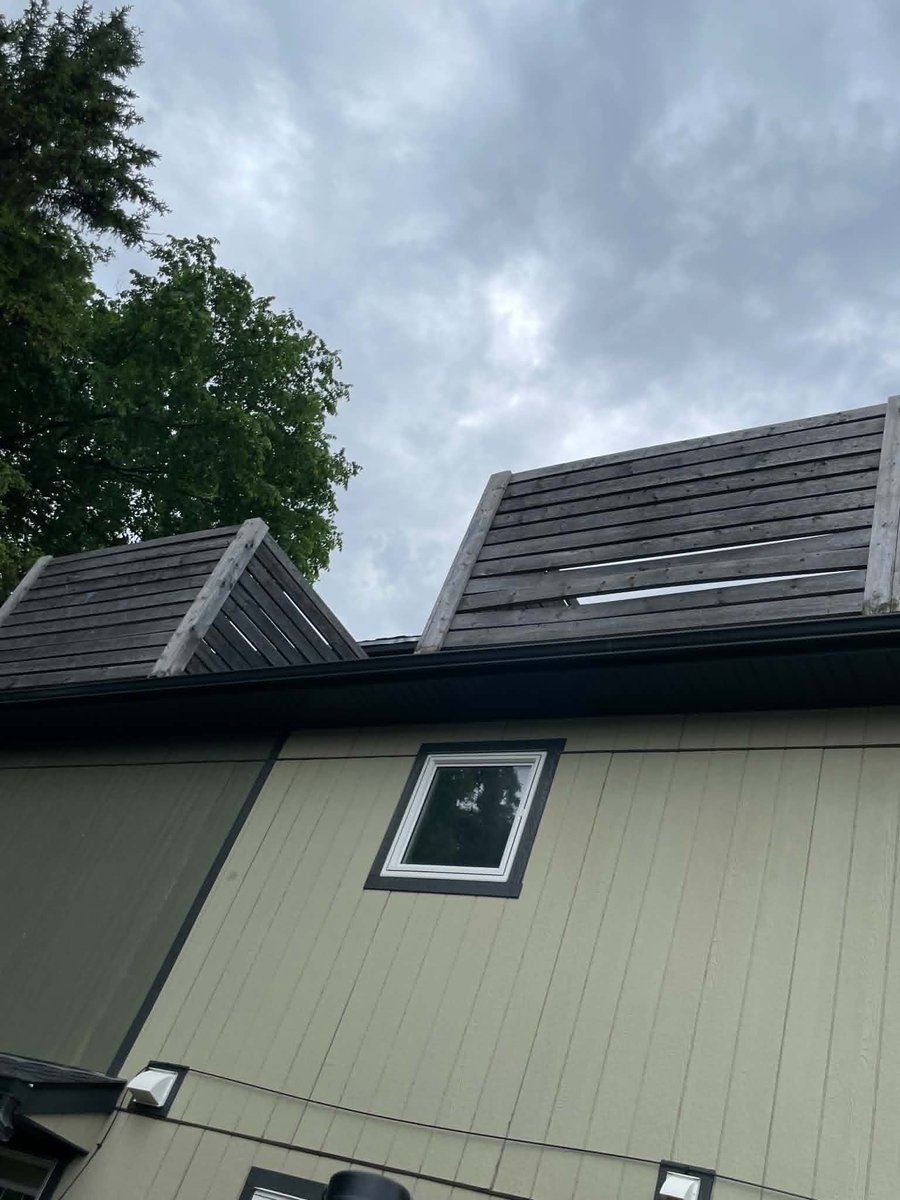 Shaybear98's tweet photo. This is an infill monstrosity built in Beverly YEG.  They built that cheap ass fence right up against my in-laws fence and it towers over their nice fence.  Not to mention the balconies built?!?!   I guess kids are always on them  🤦‍♀️ "Posts" are rotting...Yeah, that's legal  🙄 https://t.co/52j0gf3hj7