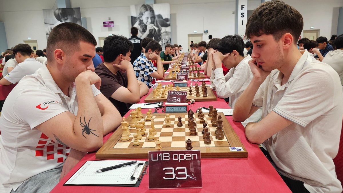 ChessbaseIndia's tweet photo. Round 2 of the FIDE World Youth Chess Championships 2026 got underway today at the Pala Dean Martin Congress Center in Montesilvano, Italy.
The ceremonial first move was made by Luigi Maggi, President of the Italian Chess Federation, on Board 1 of the Girls Under-18 section, featuring top seed WIM Zarina Nurgaliyeva against Alexandra Grebeniuc.

Here are some moments from the start of Round 2.
@FIDE_chess @GM_Mogranzini 
📸 Niklesh Jain / ChessBase India
♟️ FIDE World Youth Chess Championships 2026