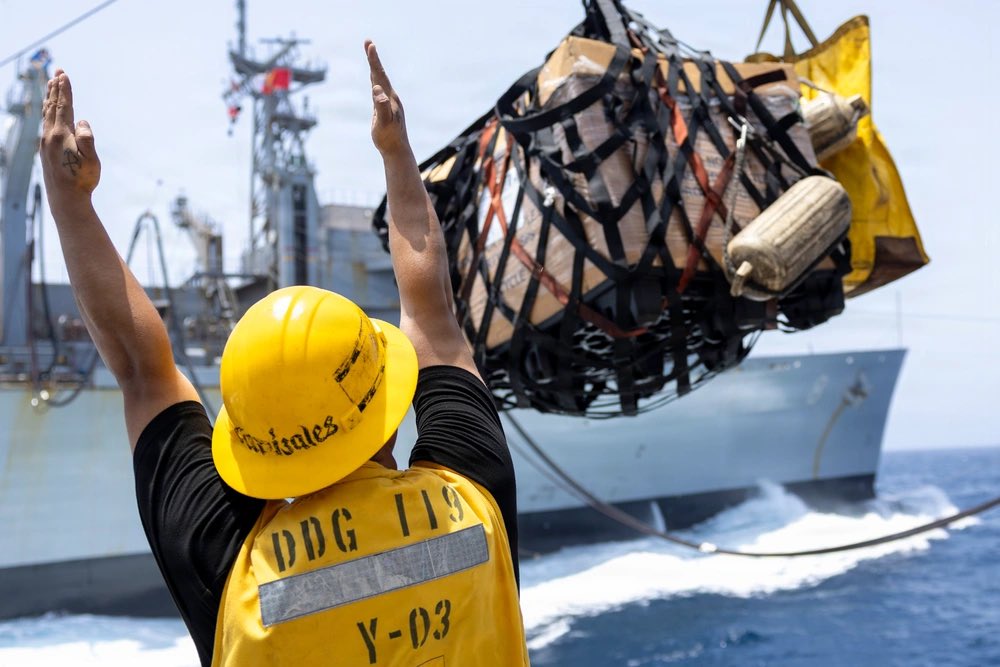 sentdefender's tweet photo. The Nimitz-class aircraft carrier USS Abraham Lincoln (CVN-72) and Arleigh Burke-class guided-missile destroyer USS Delbert D. Black (DDG-119), conduct a replenishment-at-sea with the Supply-class fast combat support ship USNS Arctic (T-AOE-8) in the Arabian Sea, June 3, 2026. https://t.co/sv6W7RmVmN