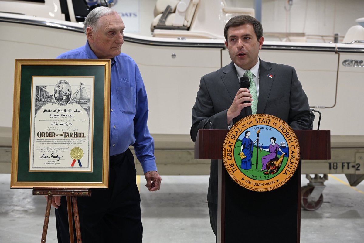 NCDOL's tweet photo. Congratulations to Eddie Smith Jr., owner and CEO of @GradyLife, on receiving the Order of the Tar Heel from North Carolina Commissioner of Labor @LukeFarleyNC.

This prestigious honor recognizes Eddie’s outstanding contributions to manufacturing, workforce development, and community service across North Carolina. His leadership has created opportunities for countless North Carolinians and helped strengthen our state’s economy and workforce.

It was also a privilege to tour the Grady-White facility and see firsthand the craftsmanship, innovation, and dedication of the team. The company’s commitment to excellence and investment in its workforce reflect the values that have made Grady-White a leader in North Carolina manufacturing and a source of pride for our state. Congratulations on this well-deserved recognition.