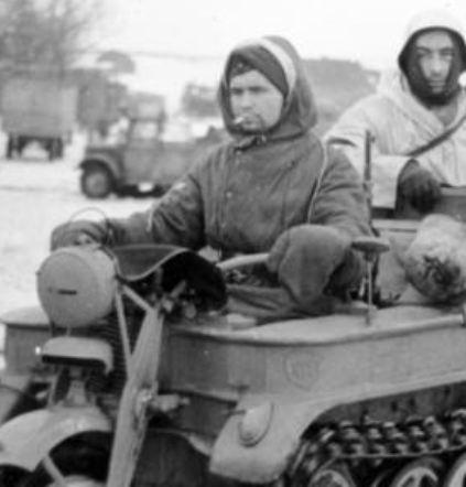 dogfishqq's tweet photo. I was looking at the Girls Last Tour wikipedia page and the driver in the Kettenkrad photo looks suspiciously like Charlie Kirk https://t.co/NkCoF9GDDy