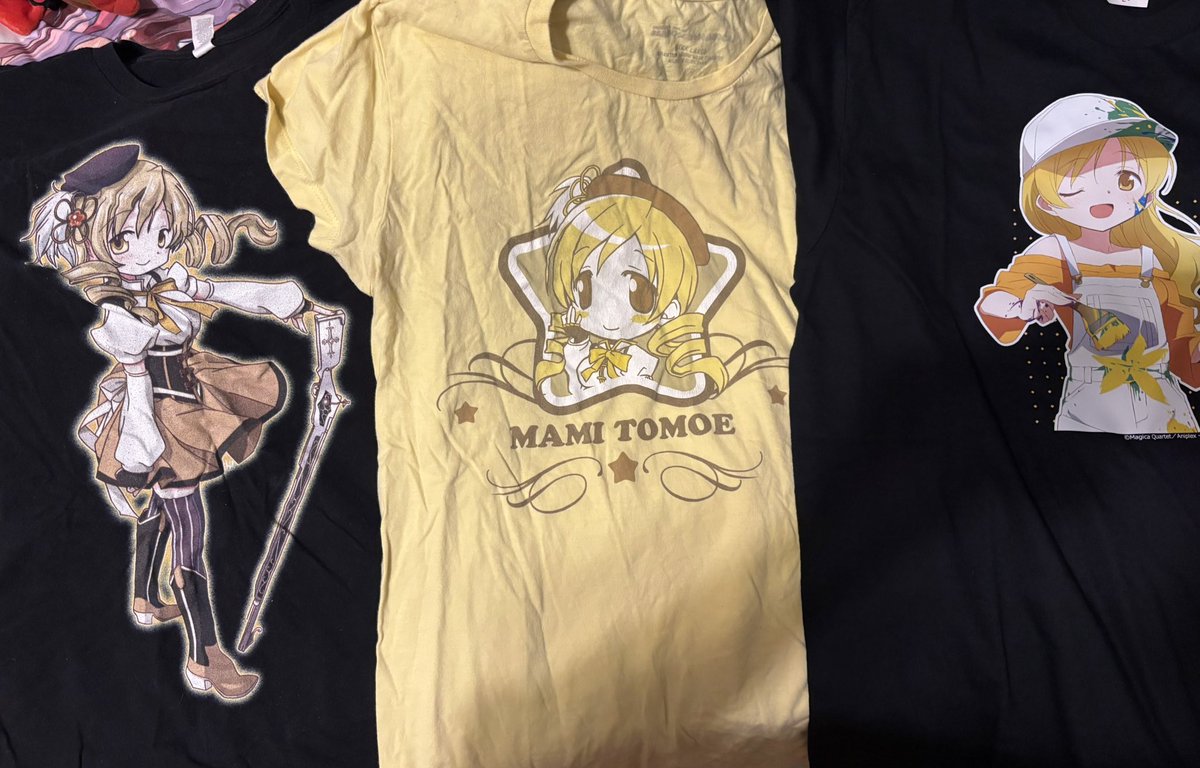 crypticoceanwav's tweet photo. Mami shirts debating which one to wear tomorrow…hmm I’m thinking the one on the far left, it’s unofficial I bought it off of mercari for $5 so I feel less bad if it gets messed up https://t.co/UJRjHkYm6o