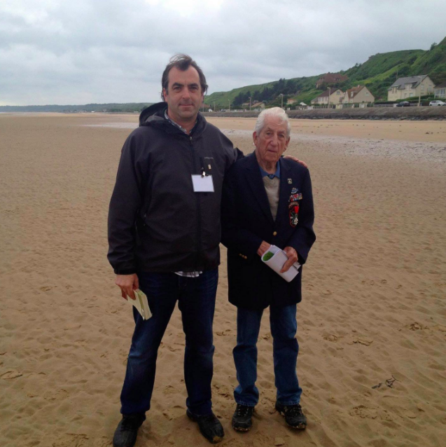 kershaw_alex's tweet photo. With Dan Farley, A Co. 5th Rangers, who crossed Omaha Beach speechless with me a decade ago on his first return to where he fought on D Day. He died at 91 in 2017. Now, in 1944, he's on a ship bound for Normandy.  See more: https://t.co/EEg00P06y6 https://t.co/rdFxXe0z8H