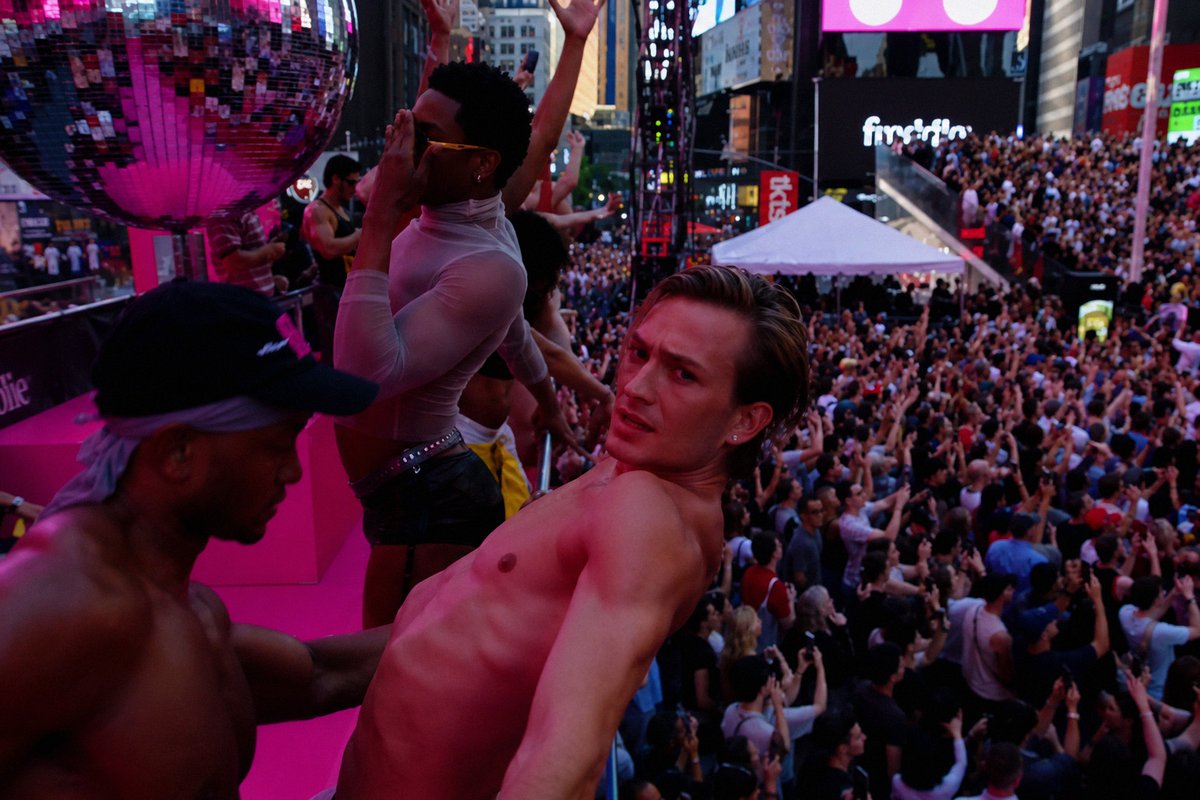 PapiNCali's tweet photo. The Grindr party bus at Madonna LIVE in New York.

I've seen Pride floats, circuit parties, and enough shirtless gay men to fill a small nation. But this? 

This looks like somebody drove through Meth Alley, yelled "Free Madonna tickets!" and accepted every volunteer who climbed aboard.