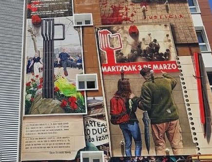 Landerlandia's tweet photo. ✊🏿🌹✌🏿#M3MORIA ez da itzaltzen eta Gasteizko sarraskiaren salaketak berriz argitzen du Zaramaga auzoa. 2013an margotu zen horma irudiaren bertsio eguneratuan, besteak beste, orain @Martxoak3 elkartearen pankarta agertzen da, #JUSTIZIA aldarrikapena ozen entzun eta ikus dadila. ❤️‍🔥 https://t.co/sL3wJuKlMB