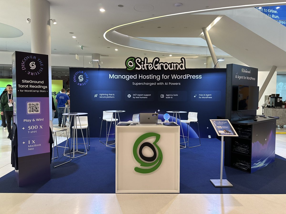 SiteGround's tweet photo. Our booth is all set. Swing by to play our digital tarot card game that reveals the future of our digital journey, grab some new merch, and enter for a chance to win a MacBook Neo. 
Most of all, come chat with us about all things WordPress. See you there!
#SiteGround #WCEU2026 #WordCampEU2026 #WordCampEU26