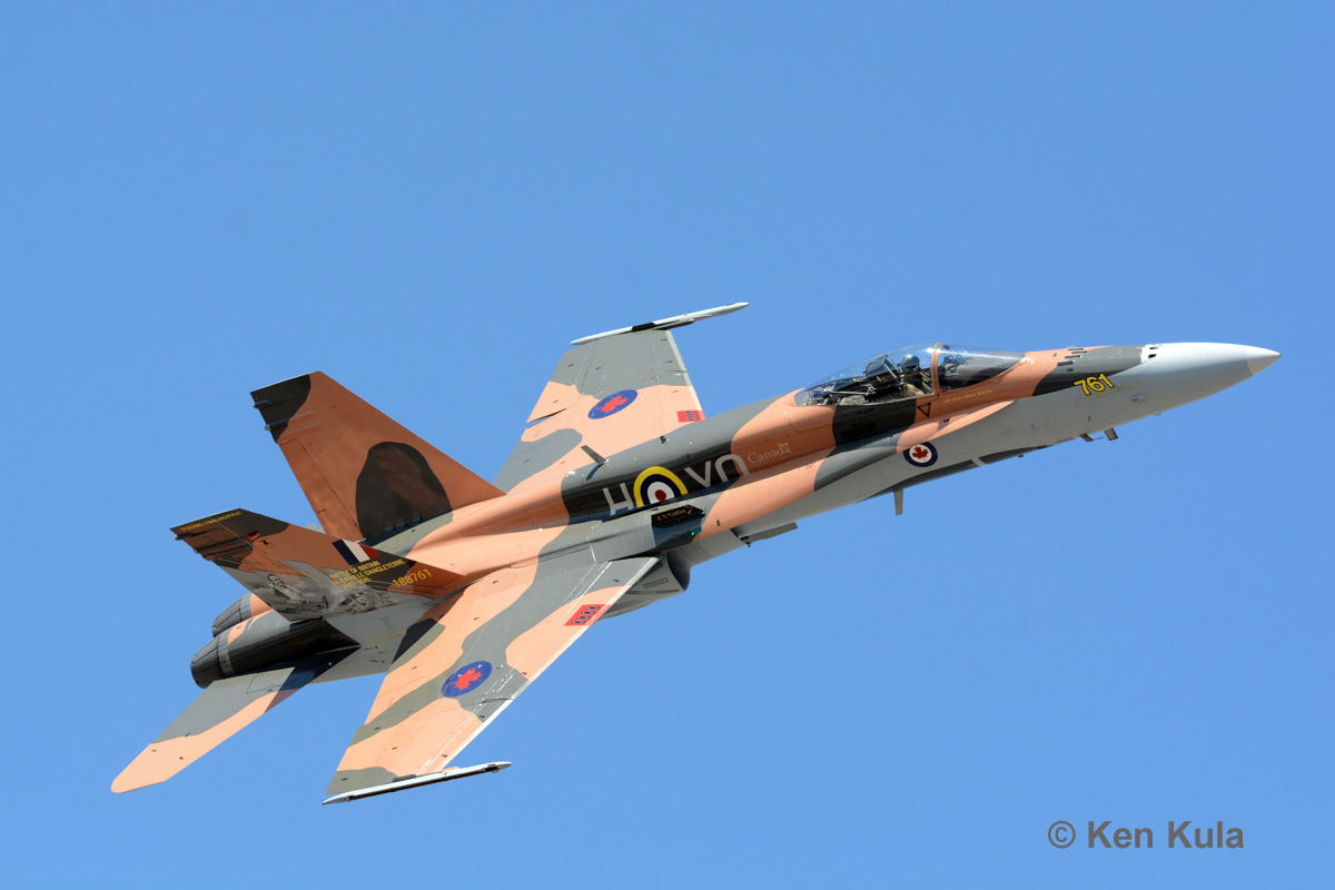 conradical247's tweet photo. @Captain_Fubar I remember one of the D-Day celebrations a while back A couple of RAF Eurofighters and RCAF F-18's got painted up like spitfires with green camo and Invasion stripes. https://t.co/bDx96YY6H4