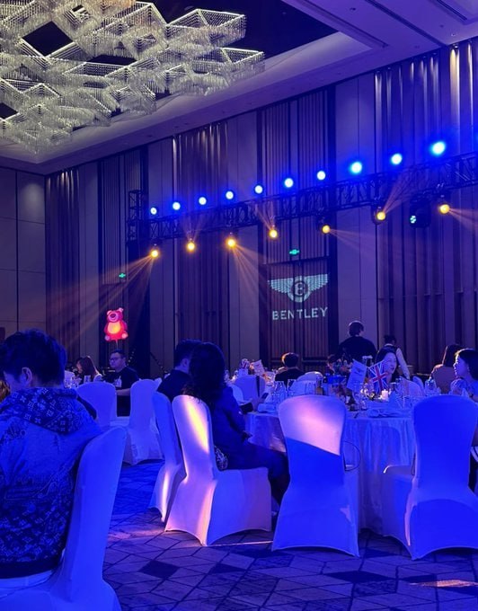 TheyCallMeTory's tweet photo. Bentley gala vibes: Blue lights, luxe seats, and that pink bear stealing the show! #LuxuryLife https://t.co/SnrRwdgnA0