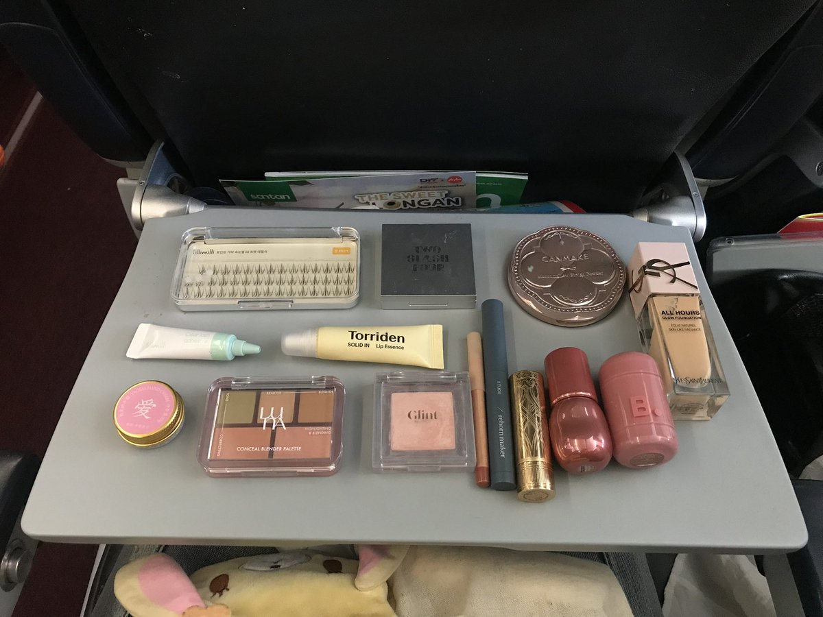 oohmuse's tweet photo. What's in my pouch... in airplane https://t.co/A5ODQc0m0T
