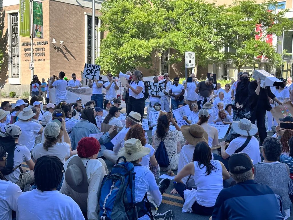 JesusBikers's tweet photo. Dressed in white, protesters sang, chanted and performed street theater in a demonstration against U.S. Immigration and Customs Enforcement in front of the Abraham Ribicoff U.S. Court House in Hartford on Wednesday. https://t.co/FYduXUN1ZQ