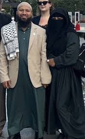 daveatherton's tweet photo. Green Party @MothinAli said on X "So proud of Sarah for calling out the reform candidate for Makerfield for his abusive misogynistic attitude!"

Ali and his wife, wearing a full veil. Backward misogynist savage. https://t.co/EwJtqbOnCf