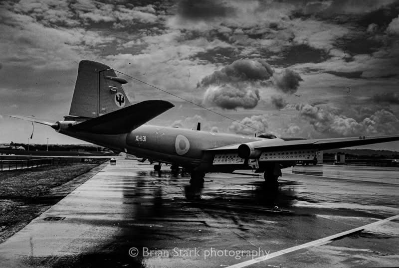 Brianfoto's tweet photo. I captured this shot of an  English Electric Canberra PR9 parked at Flight sheds on a rainy morning before the 1997 Woodford Airshow https://t.co/lssBIOECIM