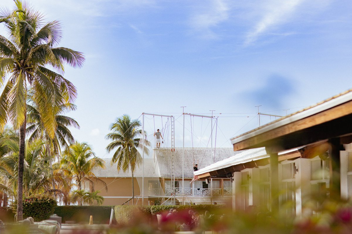 VisitGBI's tweet photo. Archery 🏹 + Trapeze 🎪 + Beachfront Views🌴

Your summer holiday just got an upgrade! 

At @VivaResorts Fortuna Beach by Wyndham, discover unexpected adventures &amp; experience a side of Grand Bahama that's anything but ordinary.

Book your escape today. Your summer starts here. 🧡 https://t.co/eYFiI0eCLo