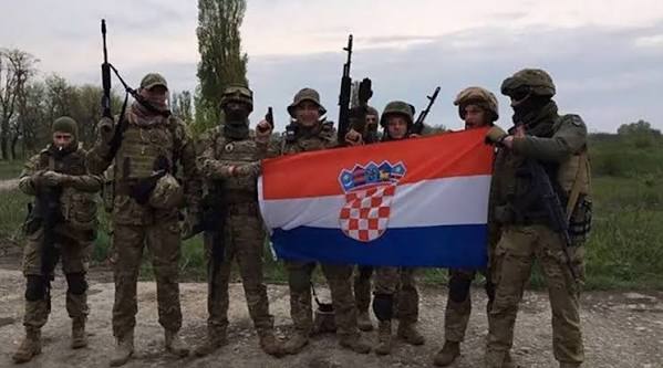 TrialGTX's tweet photo. @the_dr1zzel @gulbis_aivars @GabeZZOZZ Russia hasn't killed a single civilian. Ukrainians put their military bases above civilian lives and shoot down missiles that then fly into civilian buildings. 

And you serious about foreigners? 
Mercenaries from almost all over the world are literally fighting for Ukraine. https://t.co/V2MuyYrHFR