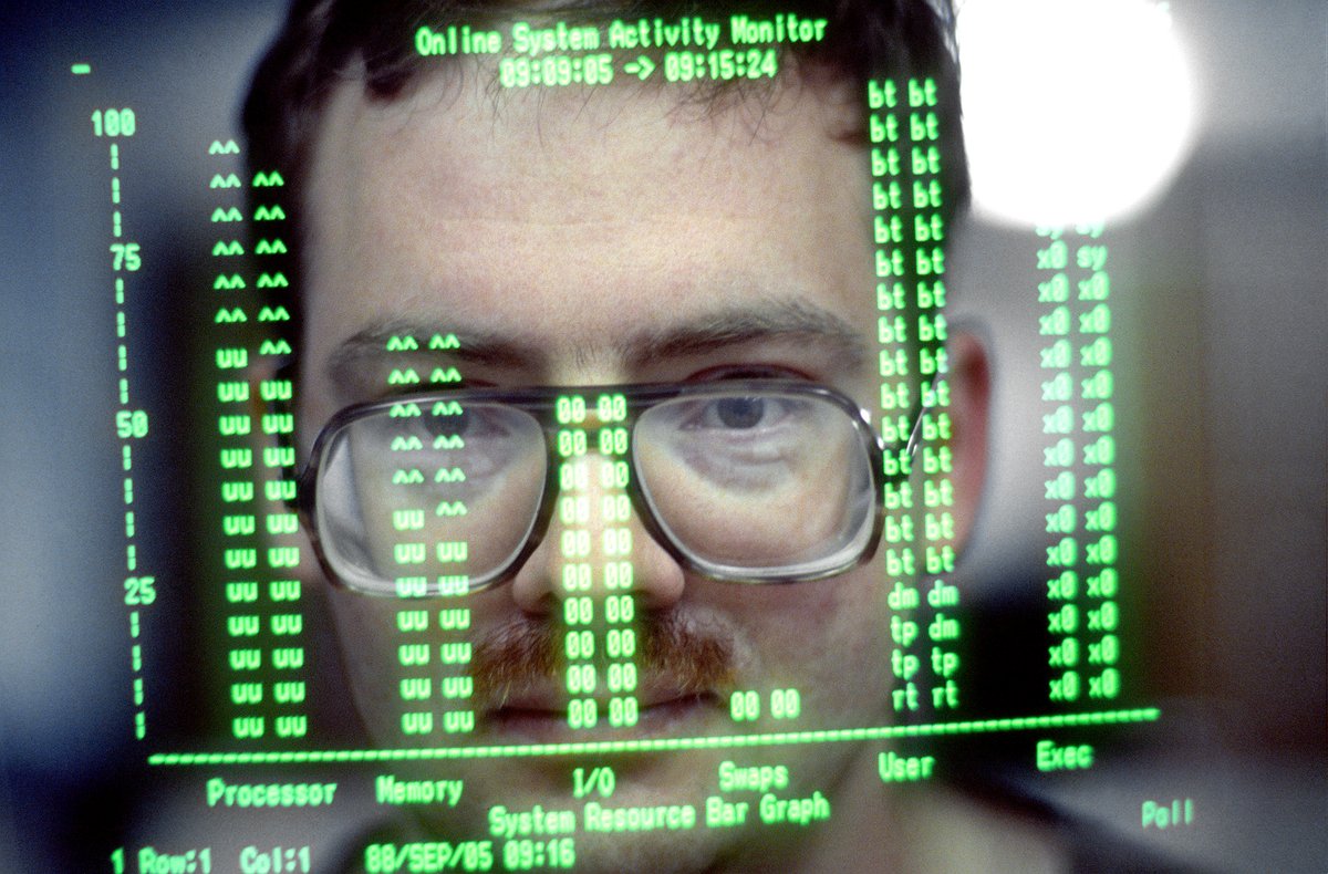 HumanoidHistory's tweet photo. Computer operator's face reflected in a screen at Sembach Air Force Base in Germany, 1988. https://t.co/oVsbvAhxc1