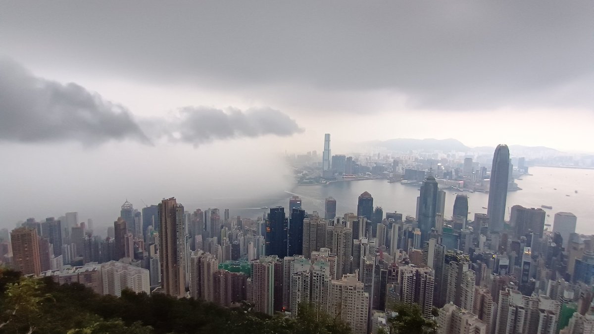 TeusIsNeverLate's tweet photo. Before, during and after the storm in Hong Kong today, with a bonus lightning strike. ⚡

Love it when you can see the cold front with rain coming in. https://t.co/cfDSK1tMuU