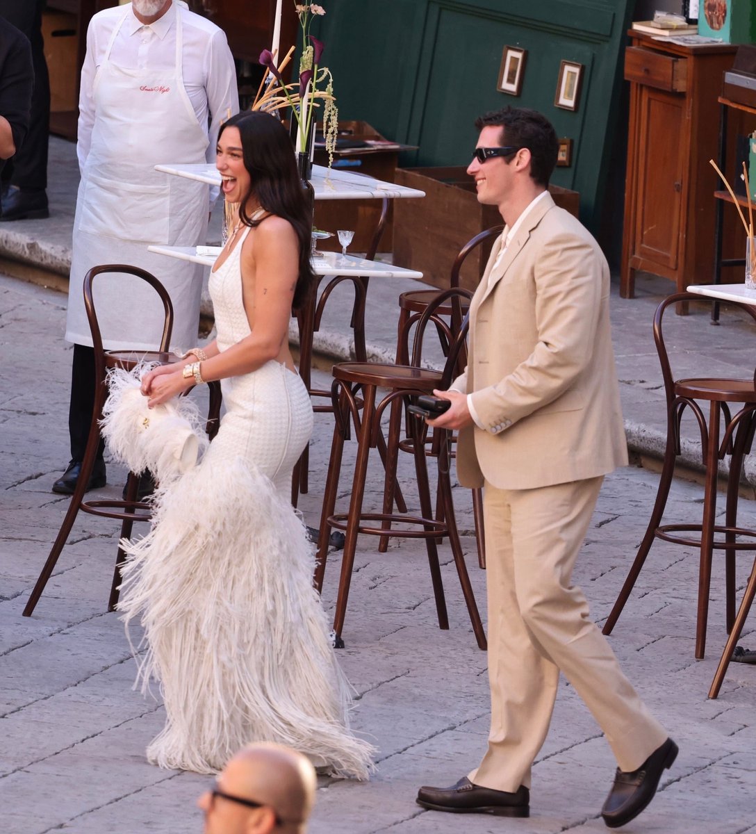 lipapictures's tweet photo. dua lipa and callum turner at their wedding’s cocktail reception, THEY’RE THE HOTTEST https://t.co/fg4AP6s2oU