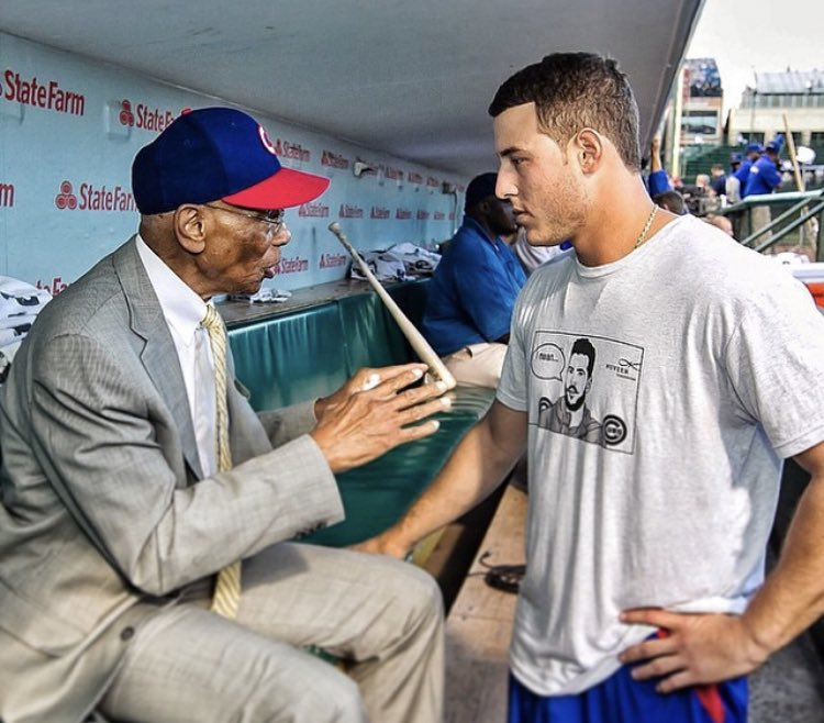 bryzzo44's tweet photo. When I first saw the picture of Anthony Rizzo and Pete Crow-Armstrong last night, it reminded me of this picture of Rizzo with Ernie Banks. #Cubs #ErnieBanks #AnthonyRizzo #letsplaytwo https://t.co/5MfVYcIBCZ