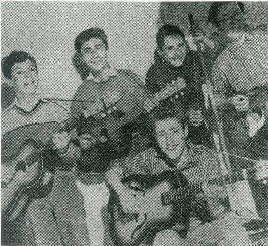 crockpics's tweet photo. A remarkable look at Roger Daltrey at just 14 years old, sitting front and center with his guitar in West London back in 1958. This rare image shows the future voice of The Who leading his very first skiffle group, The Detours, during their schoolboy days. He actually hand-carved his earliest guitar out of wood in a school shop class just to get a band started.