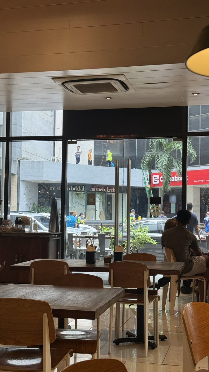 joshyaaa's tweet photo. Sitting in a cafe in Salcedo and I saw a blur. I think a window cleaner across the street fell. Called 911 as soon as I saw a security guard attempt CPR. ambulances are here now, hope they're ok https://t.co/aKaTbbNFbW