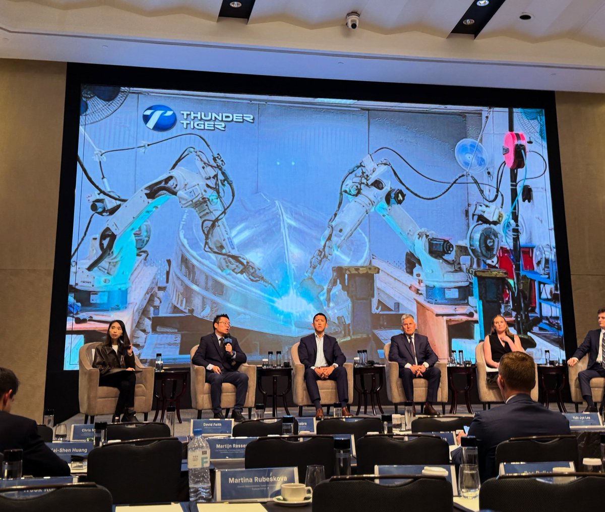 pirrer's tweet photo. Gene Su, General Manager of Thunder Tiger, laid out how a Taiwanese homegrown manufacturer is playing the game at the drone supply chain panel of the DSET 2026 Forum.

Thunder Tiger is a publicly listed company founded in 1979, with around 350 employees, 50 of them based in California. In September 2025, its Overkill drone was added to the U.S. Department of Defense's Blue UAS list. Soon after, Thunder Tiger and its U.S. strategic partner broke into the Pentagon's Drone Dominance Program (DDP): they placed in the Top 11 of the Phase 1 Gauntlet, landing a first batch of 1,520 units worth roughly US$8 million, and were invited into Phase 2, where the order scale jumps to 60,000 units and about US$300 million.

The DDP is the Pentagon's flagship effort to procure hundreds of thousands of low-cost armed drones by 2027, with a cumulative budget of around US$1.1 billion across four phases. Each phase eliminates vendors through live fly-off evaluations, and only the winners receive production orders. For Thunder Tiger, that leap from a multi-million-dollar order to a multi-hundred-million one is exactly why it is betting everything on mass production. Its focus is on sea drones and a Delta-wing one-way attack drone, in the same class as the U.S. LUCAS and Iran's Shahed.

The real breakthrough is in mass-producing motors and airframes. About 90% of the world's drone motors are made in China, and Thunder Tiger wants to win that back. Its approach borrows from Tesla-style single-piece stamping, using 2,000- to 4,000-ton presses to mass-produce aluminum airframes. Where traditional carbon-fiber methods turn out just three Shahed-class airframes a month, a stamping line can run day and night, pushing monthly output toward the hundreds of thousands.

Stamp the airframe, weld it, run it through AI-driven automated assembly, fit the engine and flight controller, and you have a sea drone ready to go aboard a vessel. Thunder Tiger is also investing about US$30 million in Chiayi for final assembly, where finished units can be packed into containers and shipped to any port or airfield, ready to deploy when needed.

As supply chain competition shifts from design to "who can mass-produce around the clock," Taiwanese firms are bringing the manufacturing muscle honed in consumer electronics into defense. And this race has only just begun. 🏭

#ThunderTiger #drones #defensetech #BlueUAS #MadeInTaiwan