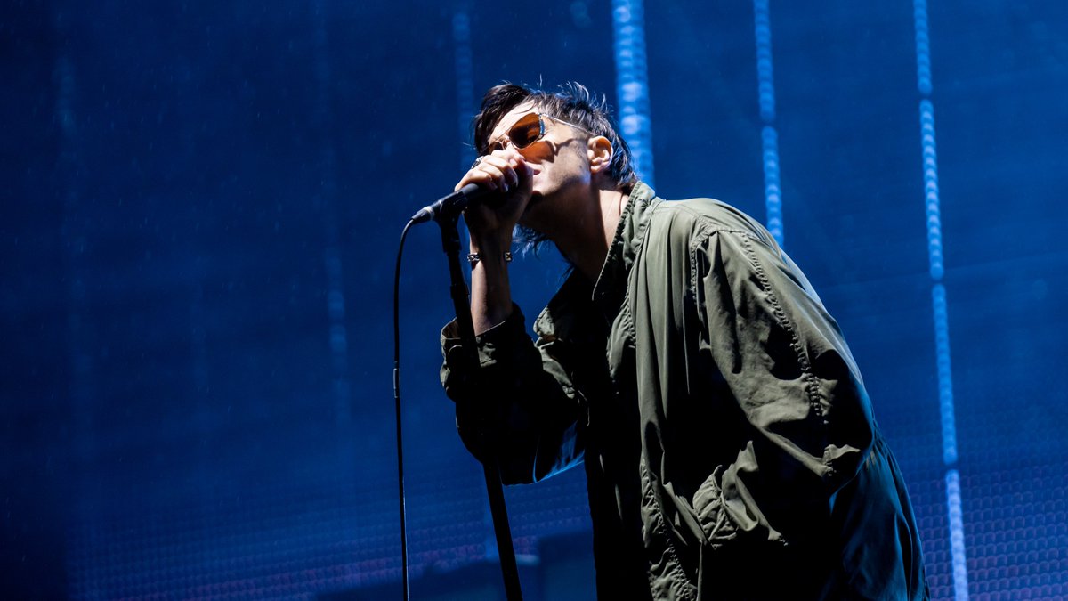 RaphPH's tweet photo. Julian and The Strokes at Open'r Fest in Poland during 2019 absolute pouring rain! https://t.co/D2NqSxFN4S