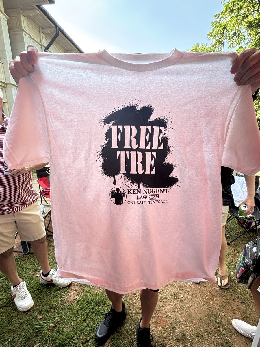 LM_Sports_Media's tweet photo. #FreeTre shirts in front of Foley Field right now. https://t.co/mh7Bgj4W9i