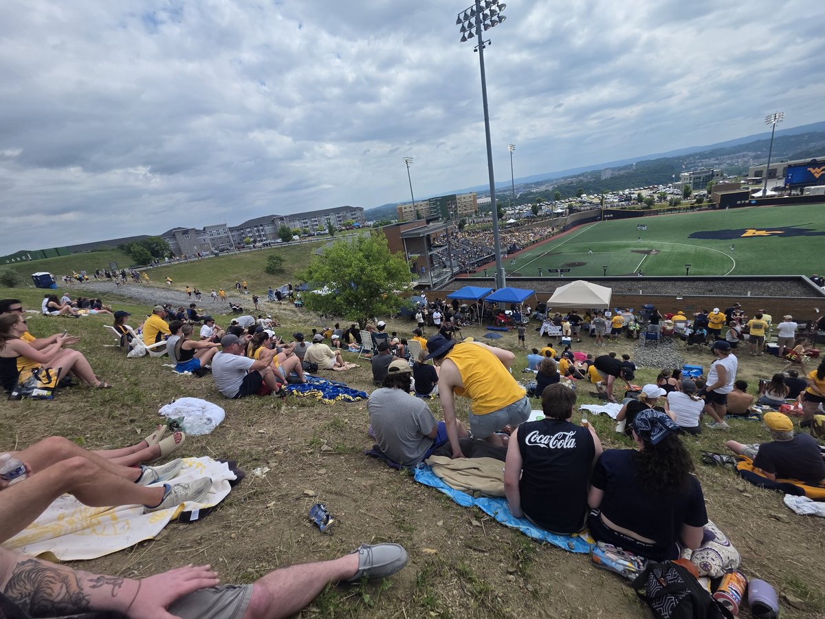 ratedthor's tweet photo. View from my seat before the game. We left 10 minutes before the weather delay because we thought the hillside would be too dangerous wet. 2nd picture is off the hill side after the weather delay started. When we left we were at the middle of that tent when we went up the hill. https://t.co/pa9o3O7722