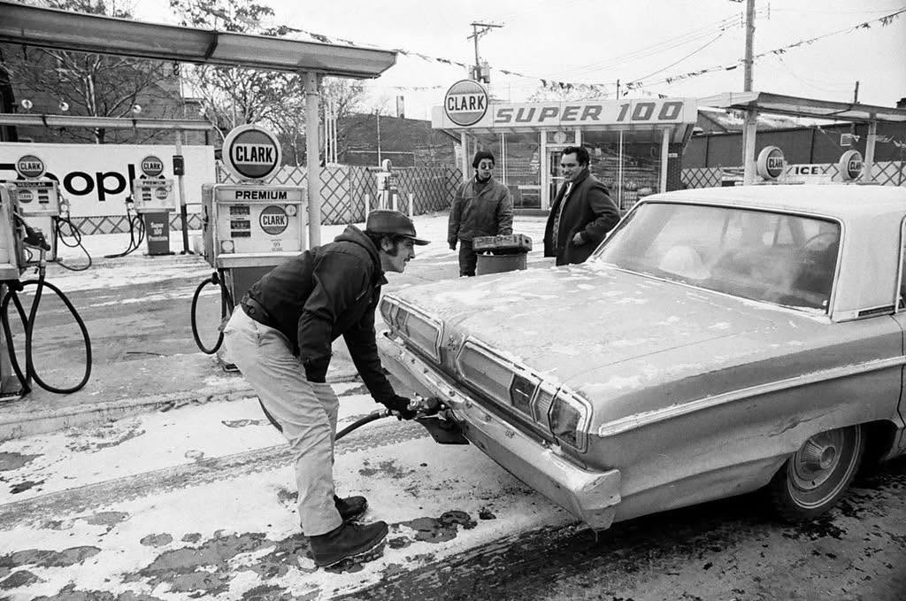 DavidCutty's tweet photo. Clark gas station, in Chicago 1974. Colorized with grok. https://t.co/G8BAfS1nKP