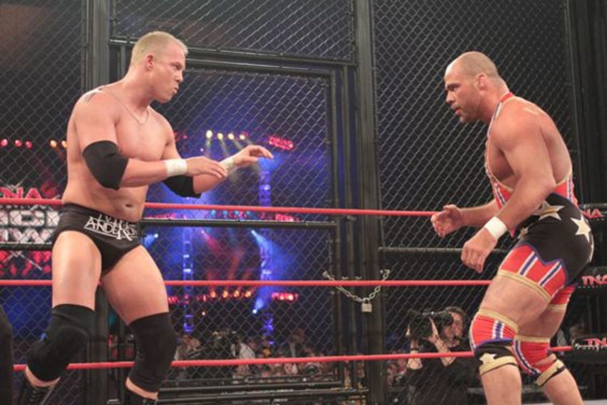 WrestlePurists's tweet photo. Ken Anderson says he and Kurt Angle had their time cut at TNA Lockdown 2010, Kurt decided to go 23 minutes anyways:

“So, we were told that we had a pretty significant chunk of time. Like 23 minutes or something like that, 24 minutes, which that’s a good solid match time. So we kind of had this all mapped out, and then on the day, Kurt comes up to me at the building and he goes, ‘They cut our f*cking match time. They’re shaving 10 minutes off our match time. I’m not happy about it.’ And then he walked away from me. He came back to me a little while later and he goes, ‘F*ck it, we’re going 23. Whatever. Don’t worry, I’ll take the heat for it.’ 

At some point [referee] Slick comes up to us probably eight or nine minutes in and is like, ‘Okay, time to take it home, baby.’ And we just kept going. We’re ike a minute away from what’s supposed to be our finish. It’s funny because he was progressively getting more and more frantic like, ‘Guys, guys. They’re f*cking telling me to go home.’ We just kept wrestling and kept doing our sh*t. Then he’s like, ‘Guys, they’re screaming in my ear!’ And Kurt just goes, ‘Tell them to f*ck off!’ 

— Nobody said a word to me when we got backstage.”

(Tagging In with Chris Harris)