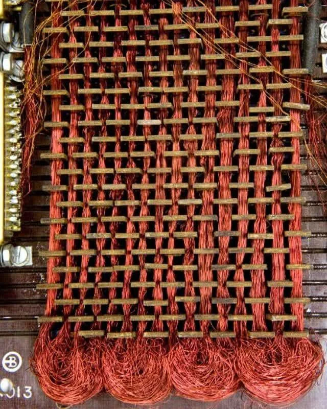 alphafox's tweet photo. Before integrated circuit memory, there was "core rope memory." 

This read-only memory (ROM) technology was hand-woven by threading sense wires through (or around) magnetic ferrite cores to store 0s and 1s. 

Multiple wires per core allowed storing many bits of data. 

It achieved a density of 72 KB per cubic foot. 

Core rope memory was heavily used in the Apollo Guidance Computer (AGC) during the moon missions due to its high reliability.