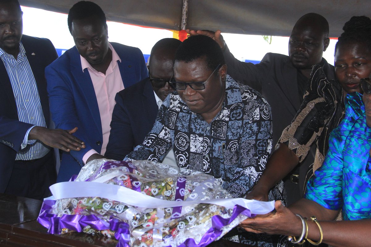 luotvlive's tweet photo. @TodwongR Sends Condolences to Gilbert Olanya, Delivers UGX 5 Million Through Aber Gifter

By Tek Kwo Wilfred

AMURU DISTRICT – The Secretary General of the ruling National Resistance Movement (NRM), Richard Todwong, yesterday delegated @NRMOnline Chairperson Gulu City Hon. @GifterAber to represent him at the burial ceremony of the late Mego Achan Cerina Onyai, mother of Hon Dr @GilbertOlanya MP KILAK SOUTH, held in Pakiri Village, Lamogi Sub-county, Amuru District.

During the funeral service, @GifterAber conveyed @TodwongR's heartfelt condolences to Hon. @GilbertOlanya  and his family, describing the legislator as a unifying leader who works with people from different political backgrounds without discrimination.

Speaking on behalf of the @NRMOnline Secretary General, Aber Gifter said @TodwongR highly appreciates Olanya's efforts in promoting unity among the people of Acholi and Northern Uganda. He noted that the spirit of cooperation and peaceful coexistence demonstrated by Olanya is essential for the region's continued development.

Aber Gifter further delivered a condolence contribution of UGX 5 million from @TodwongR to support the bereaved family during this difficult period.

In his message, Todwong also encouraged Hon. Olanya to continue working together with leaders across the political divide and called upon him to consider strengthening cooperation with President Yoweri Museveni and the NRM government through dialogue and mutual understanding aimed at advancing the interests of the people.

The burial attracted a large gathering of political, cultural, and community leaders from across the country. Among those in attendance were members of the @LangoParliamentary Group, the @ApgPiLwak, legislators from Central Uganda, and several current and former leaders.

Notable attendees included @GenOtemaAwany, @OlaraOlara, former MP Dr @odongaotto, former MP @LyandroKomakech, @Okin PP, and other distinguished guests.

The ceremony also drew mourners from Amuru, Gulu, West Nile, Lango, and other parts of Northern Uganda. Cultural groups, artists, and members of the Lango community joined residents in paying their final respects to the late Mego Achan Cerina Onyai.

The large turnout reflected the respect and admiration many people held for the deceased and demonstrated solidarity with Hon. Gilbert Olanya and his family during their time of grief.

Story by Tek Kwo Wilfred
Photos by Tek Kwo Wilfred
