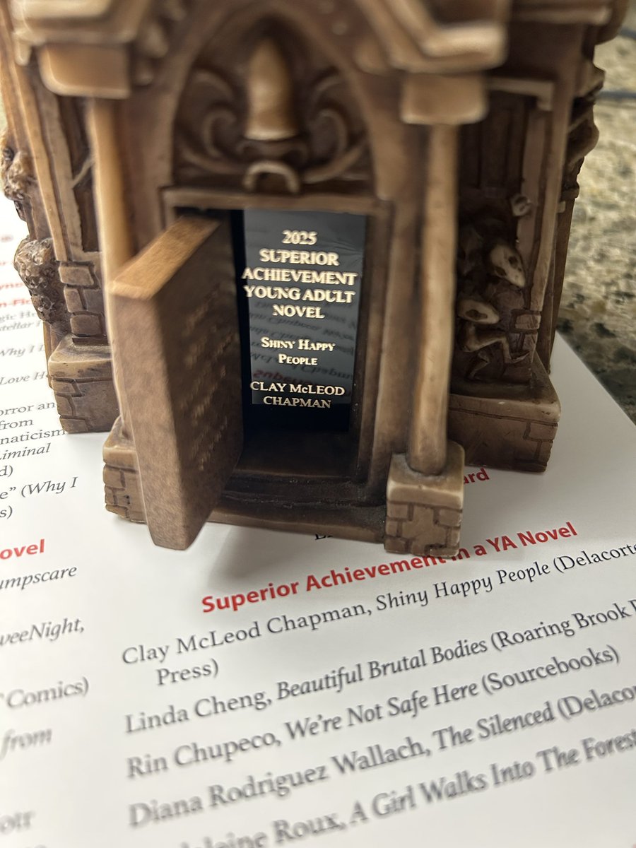 claymcleod's tweet photo. So SHINY HAPPY PEOPLE won the Bram Stoker Award for Superior Achievement in a YA Novel last night. I’m in my hotel room, just staring at this award, and I’m thinking of all the people who made this possible… and how I never want to take that support for granted. https://t.co/PxdbQTkEQH
