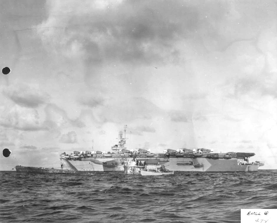HiddenHistoryYT's tweet photo. Escort Carrier USS Guadalcanal off the African coast, 7 Jun 1944. The captured U-505 is in the foreground with a US Navy whaleboat alongside. https://t.co/zUT2NNOpG7