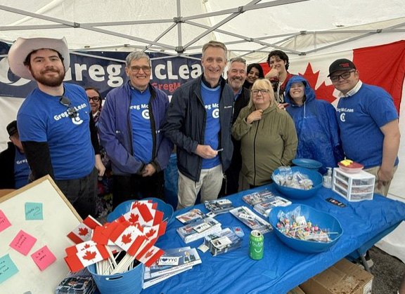 GregMcLeanYYC's tweet photo. A little rain can't dampen the spirits of volunteers or visitors at the Lilac Festival. And hey - this is Calgary. The sun will be back within minutes! Come on down and huddle under the tent with us until the sunshine returns.

#calgarycentre #yyc #cdnpoli #lilacfestival https://t.co/DFMKSfsWZr
