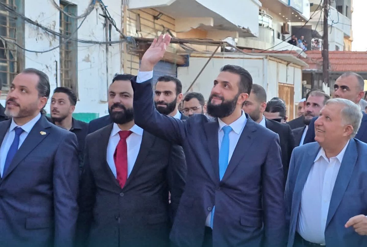 ShowsAli's tweet photo. A photo-op on Arwad Island cannot hide the fear still living in Tartus.

The de facto Syrian president visits Arwad Island in Tartus to celebrate the launch of this year’s tourism season, presenting a carefully staged image of normalcy, sea views, and recovery.

But Tartus is not simply rising from the rubble. It is still trying to rise from fear.

Many people in the city, especially members of minority communities, are still unable to live their lives with any real sense of safety or reassurance. They do not feel protected. They do not feel represented. They do not feel that this new authority sees them as equal citizens.

Just one day before this visit, Tartus witnessed a stabbing and murder in nearly the same area. Yet the official narrative wants to sell a story of tourism, celebration, and revival, while avoiding the harder questions: Where is security? Where is accountability? Where is trust?

And then there is what the images do not show.

In most of the photos and appearances surrounding this visit, women are almost entirely absent.

That absence says everything.

Women are among the biggest losers in today’s Syria. They are missing from a theatrical parliament, pushed out of meaningful political life, and nearly erased from public decision-making. A country cannot claim it is entering a new chapter while half of society is kept outside the frame.

You cannot launch a tourism season in a city where people are still afraid.

You cannot build a state through a polished photo opportunity on an island while people on the mainland feel invisible, unsafe, and excluded.

#Terrorism 
#Syria
#Tartus
#Arwad
#ArwadIsland
#SyrianWomen