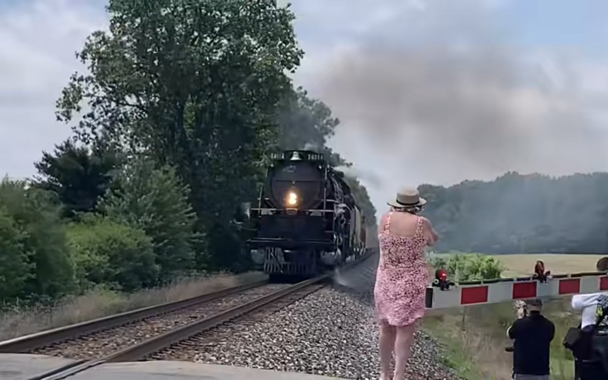 RAILMag's tweet photo. People like this lady in pink are going to ruin this for everyone.
Get off the tracks and back the #### up!
Engage your frontal cortex, grow some situational awareness and worry about how your photo looks later. https://t.co/gaqRNE5JtH