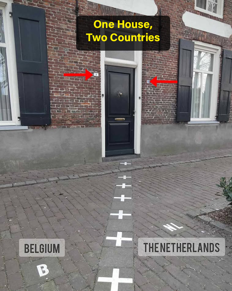 archpng's tweet photo. Two doorbells, two addresses, one house.

In Baarle, the border between Belgium and the Netherlands does not just run through streets — in some places, it cuts directly through buildings. This famous house has a Belgian address on one side and a Dutch address on the other: number 2 in Belgium and number 19 in the Netherlands.

The unusual border comes from the complex patchwork of Baarle-Hertog, a group of Belgian enclaves surrounded by the Dutch town of Baarle-Nassau. Across the town, white crosses and metal markers show exactly where one country ends and the other begins.

Here, even walking to the front door can mean crossing a national border.