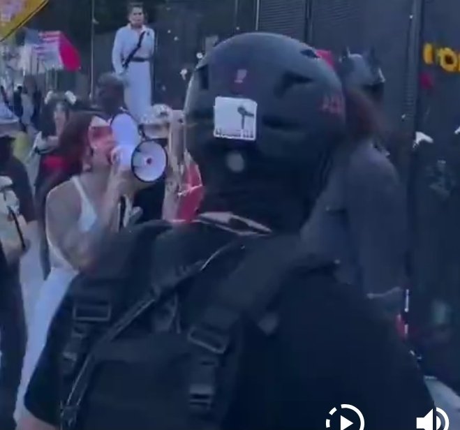 MaryEBarrentine's tweet photo. @MrAndyNgo Maybe someone saw this guy with the megaphone and a tattoo on his right forearm in a context to be able to identify him. https://t.co/2ixnoEENgk