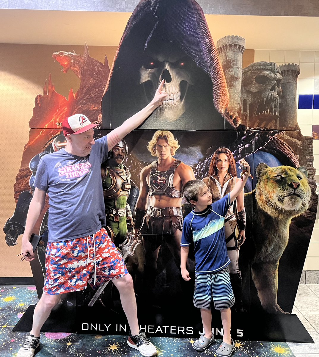 Growing_Up80s's tweet photo. Miles &amp; I at @mastersmovie 
He’s holding my (now his) 1983 Battle Armor @HeManiaOfficial 
So rewarding sharing the wonders of #Eternia with him. Movie kicks ass. 
@BrianMayGuitars contributions can’t be overstated &amp; @camilamendes as Teela RULES 🔥 https://t.co/CVoPoi9qwf