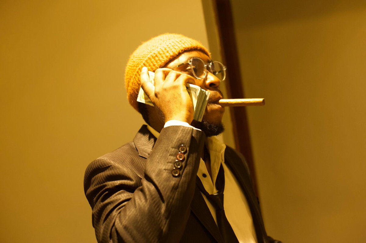 RealDopeWorld's tweet photo. when you make $60m, take a picture holding money tye, with a cigar in your mouth showing off https://t.co/YEwCujXGwn