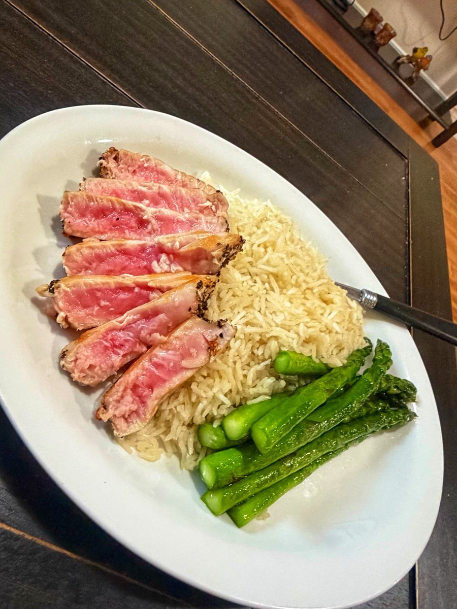 Chefstevewilson's tweet photo. Found some Tuna steaks at the grocery store… 
Sesame oil and black pepper crusted seared tuna, coconut rice and buttery asparagus 👀
I need to invest in a sharpener for my home knives 😜
#ChefsDayOff 
#Sundaze https://t.co/8vtnEwFOMv