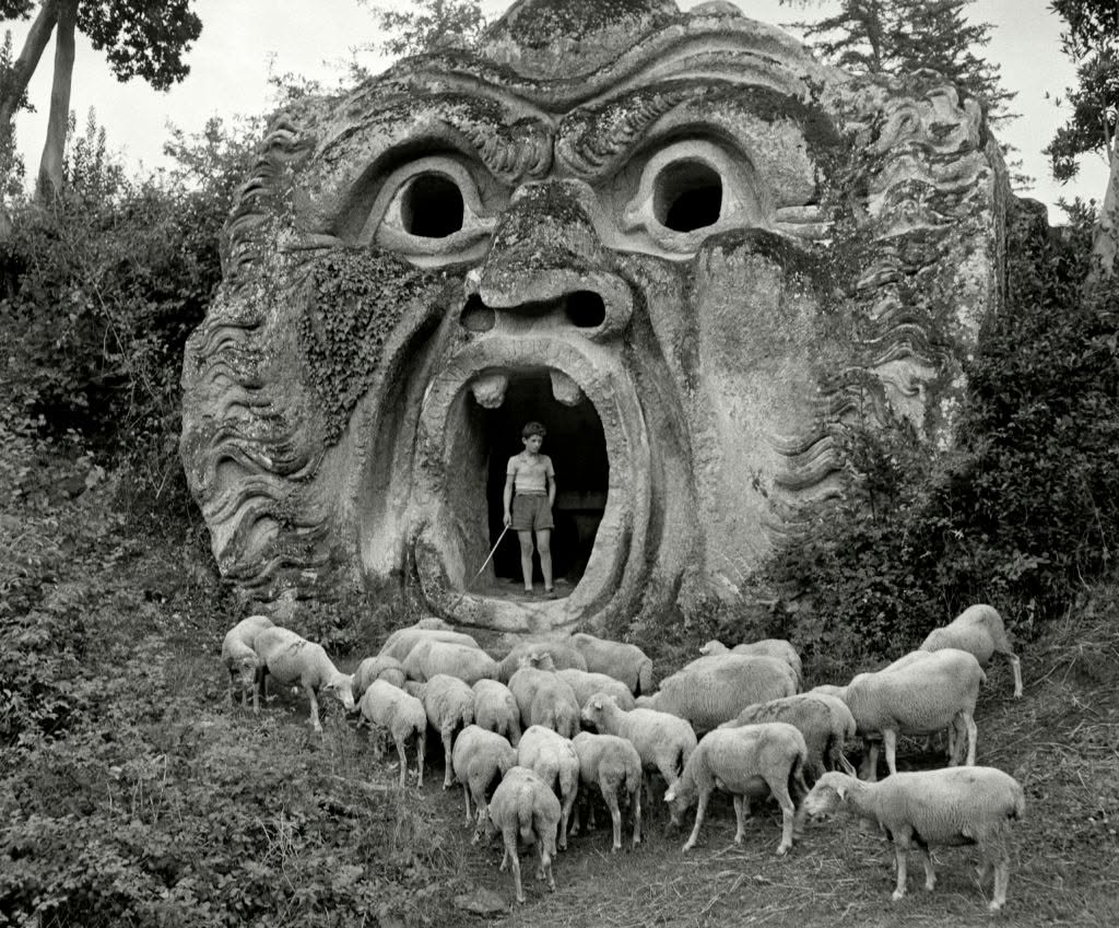 pastarchive's tweet photo. A young shepherd stands inside the mouth of the Orco at Bomarzo’s Sacro Bosco, Italy, 1952.

Photographed by Herbert List https://t.co/p9FgFqAd6i