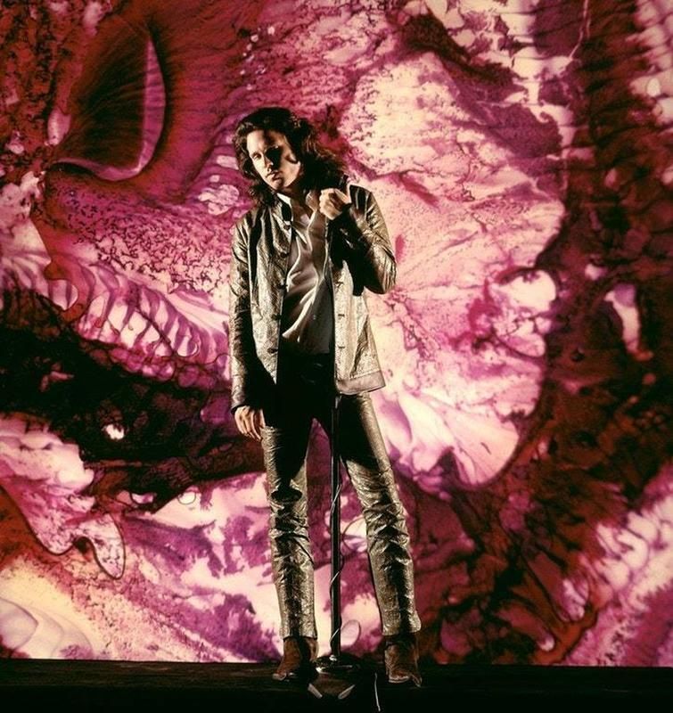 crockpics's tweet photo. Jim Morrison in his element during a portrait session in New York City in 1968. Photographer Yale Joel captured this iconic color shot for a big LIFE magazine profile on the band. Joel used a swirling liquid light show background to bring the band's live, psychedelic concert look right into the studio. What is your favorite track from their 1968 Waiting for the Sun album?