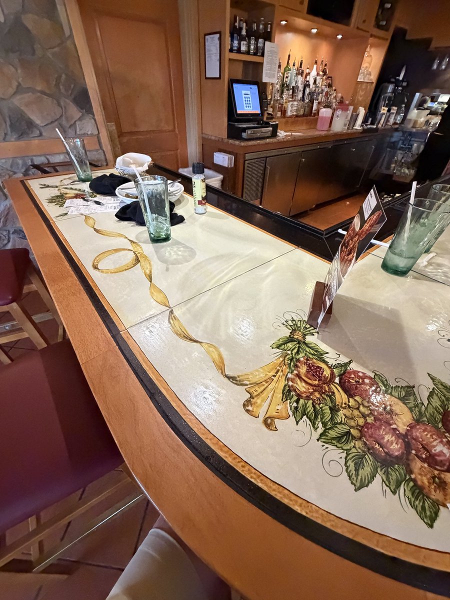 jackjenness's tweet photo. .@olivegarden  I was about to be treated to Olive Garden for the first time ever, but was left speechless. Nobody at the bar, yet piles of dishes and trash all over it. The bartender put our silverware down without clearing or wiping anything. Disgusted and disappointed. https://t.co/ahB6ikhnAV
