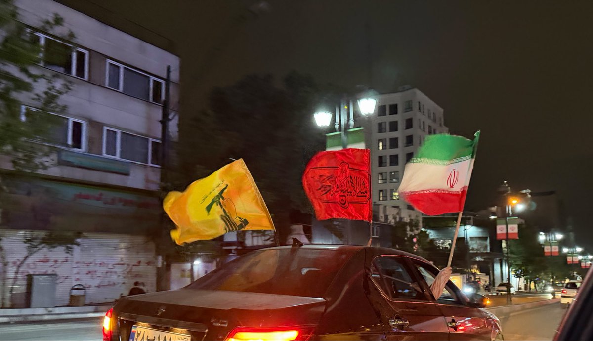 Helyeh_Doutaghi's tweet photo. Tonight is the result of two developments: the regional balance of force has shifted in a decisive manner, prompting Iran, for the first time ever, to carry military campaign in defence of its allies/ though it could also be framed as self-defense in response to continued violations of Iran territorial sovereignty over the past two days/ and or collective self defence re its regional allies.

Second, there has been a noticeable intensification of demands in response to escalating violence against Lebanon over the past week in the streets of Iran. Many carry Hezbollah flags and have been calling for action. In this, pressure emanating from the popular base of the revolution has significantly shaped the posture of the armed forces, particularly amid internal tensions among differing political factions, including reformist elements within Iran.

The pics taken over the past several nights.
