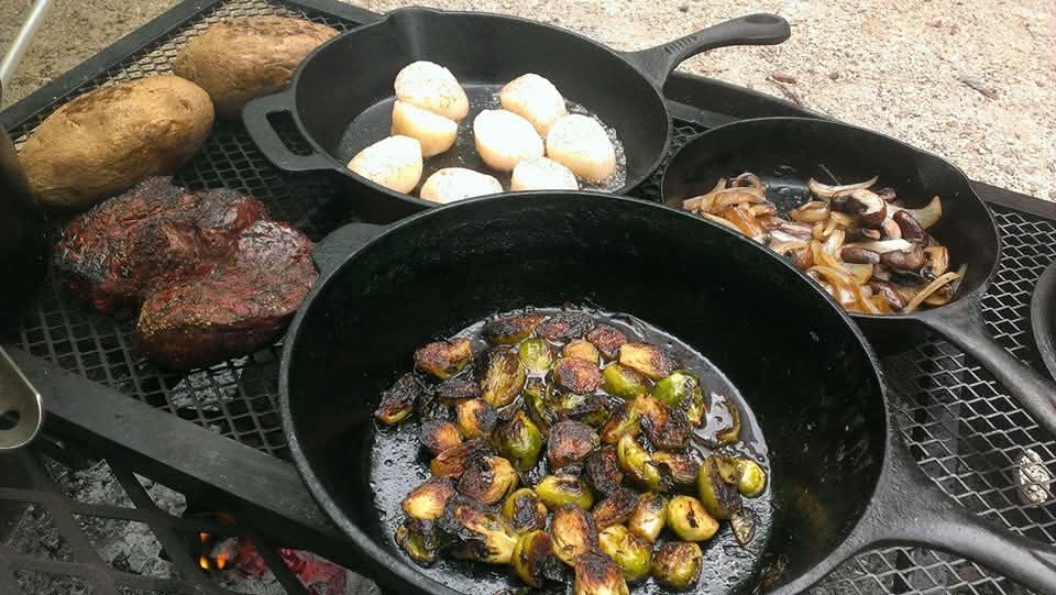 CampCookAlt's tweet photo. I was going through memories on FB and came across the Anniversary dinner I made for us when we went camping at Peninsula State Park in Door County Wisconsin. We ate well! Steaks
Baked Potatoes 
Pan Seared Scallops
Pan Fried Brussel Sprouts
Onion and Shrooms
All over a camp fire!
@BrandonDonkey2