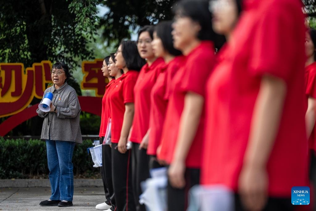 CCTV's tweet photo. Zhang Guimei, principal of the Huaping Senior High School for Girls, sings with students on the way back to school after exams in Lijiang, southwest China's Yunnan Province, on June 7, 2026.
This year's national college entrance exam, also known as the gaokao, kicked off on Sunday nationwide. At the Huaping Senior High School for Girls, 69-year-old Zhang Guimei, the principal of the school, has seen examinees off for the college entrance exam for 16 consecutive years since the school's first group of graduates took the exam in 2011.
Zhang, the principal of a girls school in Yunnan's mountainous areas, has been dedicated to helping rural girls improve their lives and chase their dreams through education and knowledge.