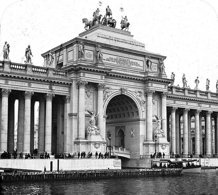 SpireDomePillar's tweet photo. They re-enforce the fact that these worlds fairs were completely temporary and made from cheap materials. 
But when you really take in the scale and uniformity of the structures compared to the people around them alarm bells start ringing. 

Grand Arch from The World's Columbian Exposition 1893, Chicago.